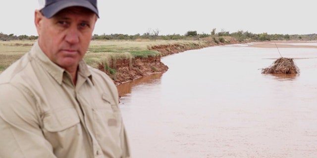 Ken Aderholt is pictured here along the bank of the Red River in Wilbarger County, Texas.
