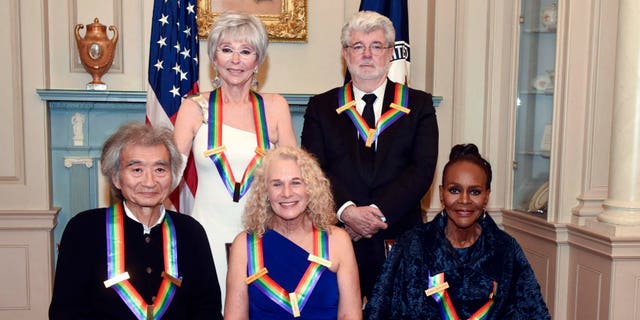 Dec 5, 2015. The 2015 Kennedy Center Honorees, from left, Seiji Ozawa, Rita Moreno, Carole King, George Lucas and Cicely Tyson pose for a group photo following the State Department Dinner for the Kennedy Center Honors in Washington.