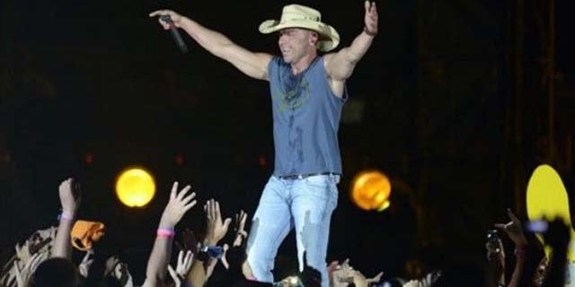 Country star, Kenny Chesney, brings the crowd to their feet.