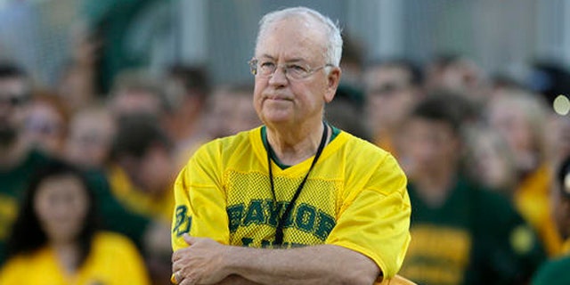 In the Sept. 12, 2015 file photo, Baylor President Ken Starr waits to run onto the field before an NCAA college football game in Waco, Texas.