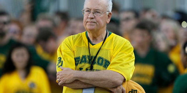In the Sept. 12, 2015 file photo, Baylor President Ken Starr waits to run onto the field before an NCAA college football game in Waco, Texas.