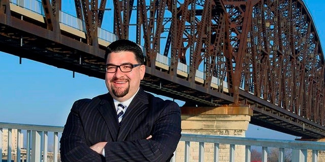 In this 2018 photo provided by Alvarez for Judge, Louisville lawyer Danny Alvarez poses for a photo in Louisville, Ky. Alvarez, 43, has died one day after advancing in a primary election in a judicial race. Family friend and campaign consultant Jonathan Hurst said in an email that Danny Alvarez died Wednesday, May 23, 2018. (Alvarez for Judge via AP)