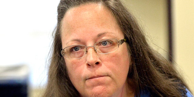 Sept. 1, 2015: Rowan County Clerk Kim Davis listens to a customer following her office's refusal to issue marriage licenses at the Rowan County Courthouse in Morehead, Ky.