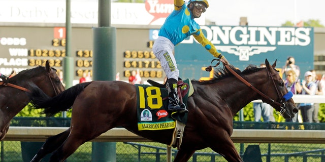 May 2, 2015: Victor Espinoza rides American Pharoah to victory in the 141st running of the Kentucky Derby horse race at Churchill Downs in Louisville, Ky. (AP)