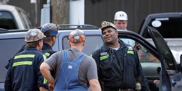 June 20: Pernell Witherspoon is congratulated after being rescued from within the Jellico Mine No 1. in Middlesboro, Ky. Three mine maintenance workers were freed and appeared to be in good health Monday after being trapped for 14 hours in the flooded southeastern Kentucky mine. (AP)
