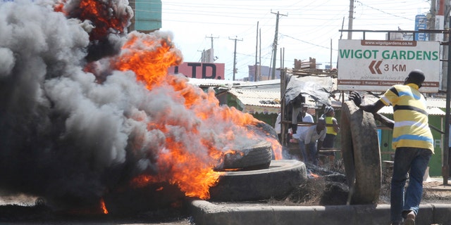 Nasa supporters burn tires, in Kisumu, Kenya, Monday Oct.2, 2017. Kenyan police lobbed tear gas and fired shots in the air in Nairobi and Kisumu Monday to disperse protesters who are demanding a change of leadership at the country's election commission. (AP Photo)
