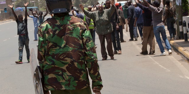 Riot police prevent demonstrators from reaching the Independent Electoral and Boundaries Commission offices in Nairobi, Kenya, Oct. 2, 2017.