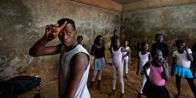 Young ballerinas receive instruction from Kenyan ballet dancer Joel Kioko, 16.
