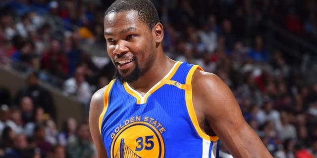 PHILADELPHIA, PA - FEBRUARY 27: Kevin Durant #35 of the Golden State Warriors looks on against the Philadelphia 76ers at Wells Fargo Center on February 27, 2017 in Philadelphia, Pennsylvania NOTE TO USER: User expressly acknowledges and agrees that, by downloading and/or using this Photograph, user is consenting to the terms and conditions of the Getty Images License Agreement. Mandatory Copyright Notice: Copyright 2017 NBAE (Photo by Jesse D. Garrabrant/NBAE via Getty Images)
