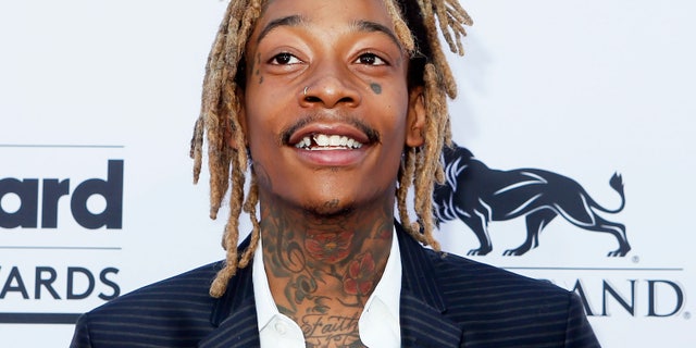 Rapper Wiz Khalifa cuffed for riding hoverboard | Fox News Rapper Wiz Khalifa cuffed for riding hoverboard | Fox News