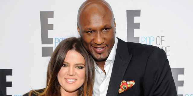 FILE - In this April 30, 2012, file photo, Khloe Kardashian Odom and Lamar Odom from the show "Keeping Up With The Kardashians" attend an E! Network upfront event at Gotham Hall in New York. A Los Angeles judge on Friday, Dec. 9, 2016, finalized Kardashian and Odom's divorce nearly three years after she first filed to end their marriage. The pair were married in September 2009 and court records show many financial details of
the divorce were subject to a prenuptial agreement. (AP Photo/Evan Agostini, File)