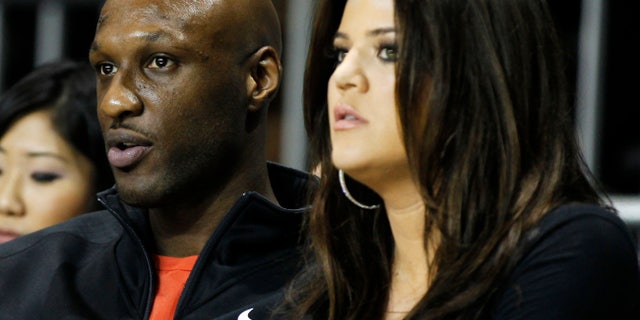 February 18, 2011. Lamar Odom and his wife television personality Khloe Kardashian sit courtside as they attend the 2011 BBVA All-Star Celebrity basketball game as a part of the NBA All-Star basketball weekend in Los Angeles,