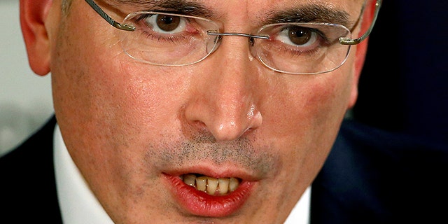 Mikhail Khodorkovsky speaks during a news conference in Berlin, Sunday, Dec. 22, 2013. The former oil baron and prominent critic of Russian President Vladimir Putin, Mikhail Khodorkovsky, was reunited with his family in Berlin on Saturday, a day after being released from a decade-long imprisonment in Russia. (AP Photo/Michael Sohn)