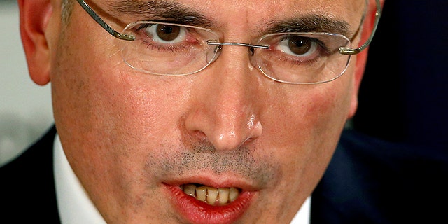 Mikhail Khodorkovsky speaks during a news conference in Berlin, Sunday, Dec. 22, 2013. The former oil baron and prominent critic of Russian President Vladimir Putin, Mikhail Khodorkovsky, was reunited with his family in Berlin on Saturday, a day after being released from a decade-long imprisonment in Russia. (AP Photo/Michael Sohn)