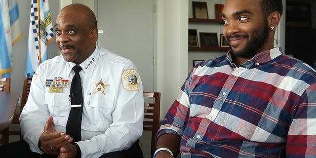 The Chicago Sun-Times says Daniel Johnson got a big hug from his new boss, police Superintendent Eddie Johnson, when he crossed the stage Tuesday.