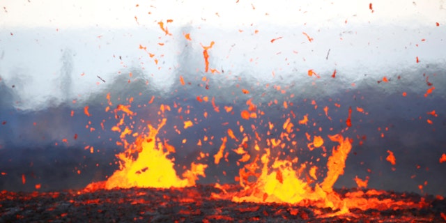 Lava erupts from a fissure on the outskirts of Pahoa during ongoing eruptions of the Kilauea Volcano in Hawaii, U.S., May 14, 2018. (REUTERS/Terray Sylvester)
