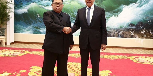Korean leader Kim Jong Un, left, and Russia's Foreign Minister Sergei Lavrov pose for a photo during a meeting in Pyongyang, North Korea, Thursday, May 31, 2018 .
