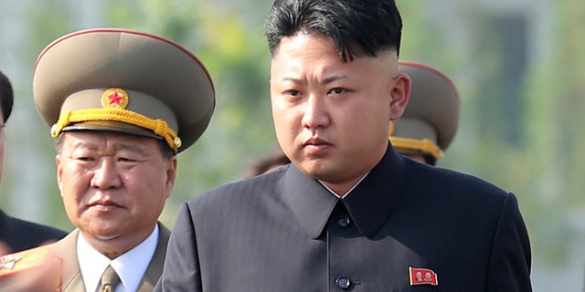 July 25, 2013: In this file photo, North Korean leader Kim Jong Un, center, arrives at the cemeteries of fallen fighters of the Korean People's Army (KPA) in Pyongyang, North Korea.