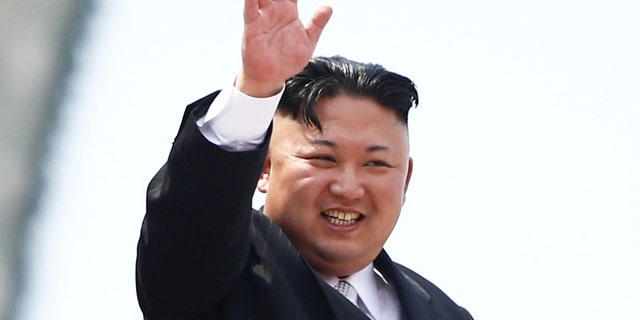 North Korean leader Kim Jong Un waves to people attending a military parade marking the 105th birth anniversary of country's founding father, Kim Il Sung in Pyongyang, April 15, 2017.