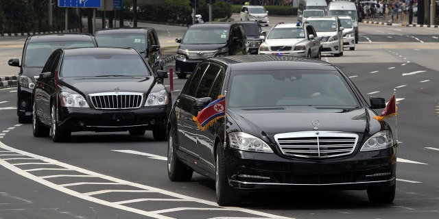 A motorcade believed to be carrying North Korean leader Kim Jong Un travels along Singapore's Orchard Road, June 10, 2018.