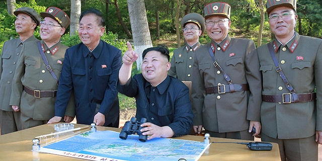 North Korean leader Kim Jong Un inspects the intermediate-range ballistic missile Pukguksong-2's launch test May 22, 2017.