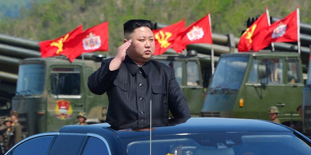 North Korean leader Kim Jong Un salutes members of his nation's military.