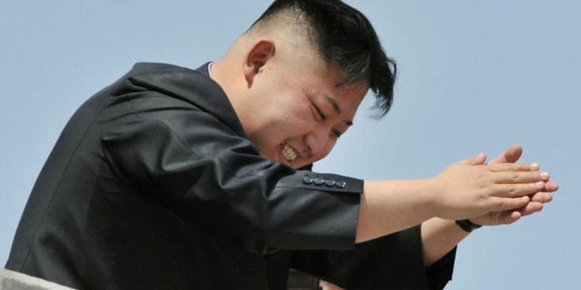 April 15, 2012: North Korean leader Kim Jong-un applauds as he leaves after a mass military parade in Pyongyang.