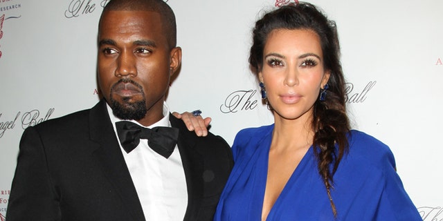 This Oct. 22, 2012 photo released by Starpix shows rapper Kanye West, left, with his girlfriend Kim Kardashian at Gabrielle's Angel Foundation 2012 Angel Ball cancer research benefit at Cipriani Wall Street in New York.