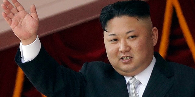 Kim Jong Un waves during a military parade in Pyongyang, North Korea, on April 15.