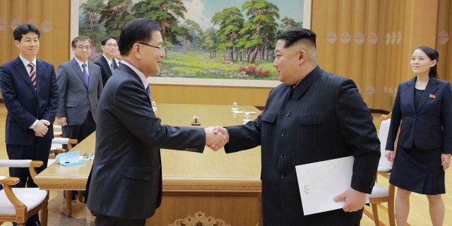 North Korean leader Kim Jong Un, front right, shakes hands with South Korean National Security Director Chung Eui-yong after Chung gave Kim a letter from South Korean President Moon Jae-in, in Pyongyang, North Korea.