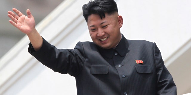 July 2013: North Korean leader Kim Jong Un waves to war veterans during a mass military parade celebrating the 60th anniversary of the Korean War armistice in Pyongyang.