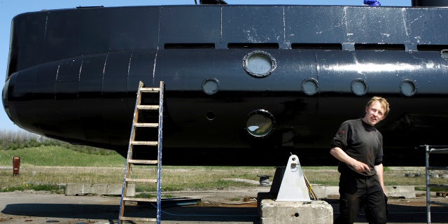 This April 30, 2008 file photo shows a submarine and its owner Peter Madsen.