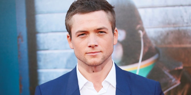 Actor Taron Egerton poses at the world premiere of the film "Sing" in Los Angeles, California, December 3, 2016. REUTERS/Danny Moloshok - RTSUJBM