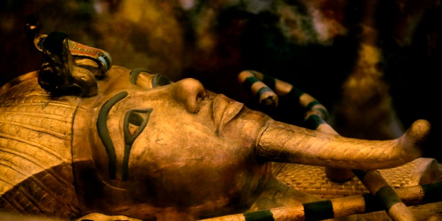 FILE - In this Thursday, Nov. 5, 2015 file photo, Egypt's famed King Tutankhamun's golden sarcophagus is displayed at his tomb in a glass case at the Valley of the Kings in Luxor. (AP Photo/Amr Nabil)