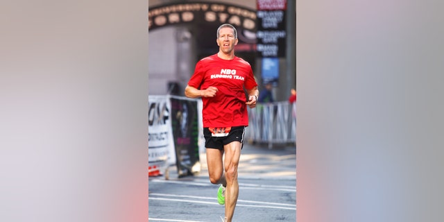 Kirk Smith at the finish line of a half marathon he ran two years ago.