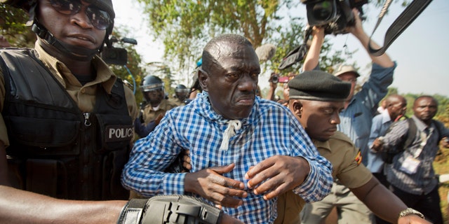 Feb. 22, 2016: Uganda's main opposition leader Kizza Besigye, center, is arrested by police and thrown into the back of a blacked-out police van which whisked him away and was later seen at a rural police station, outside his home in Kasangati, Uganda.