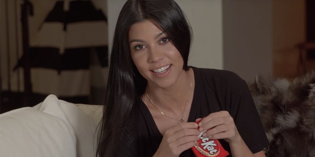 "Give me a break!" Kourtney Kardashian show how to eat a single Kit Kat bar in 6 steps.