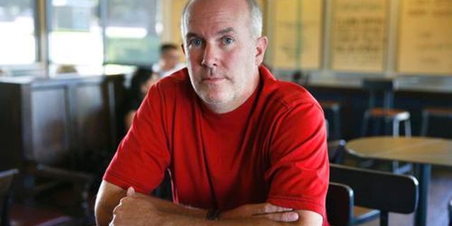 James Beach, 48, is the United Airlines passenger who had water thrown in his face after using the Knee Defender, which prevented the passenger in front from reclining her seat.