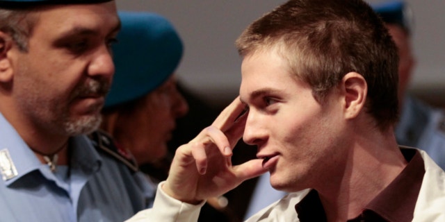 October 3, 2011: Raffaele Sollecito, the Italian student who was tried in the murder of Meredith Kercher in Italy in November 2007, gestures as he arrives for his appeal trial session in Perugia.