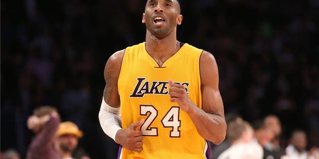 LOS ANGELES, CA - JANUARY 13: Kobe Bryant #24 of the Los Angeles Lakers reacts as he runs off the court after missing his three point attempt to tie the score as time ran out in the game against the Miami Heat at Staples Center on January 13, 2015 in Los Angeles, California. The Heat won 78-75. NOTE TO USER: User expressly acknowledges and agrees that, by downloading and or using this photograph, User is consenting to the terms and conditions of the Getty Images License Agreement. (Photo by Stephen Dunn/Getty Images)