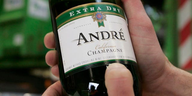FILE 2008: A man displays a bottle of fake Champagne.