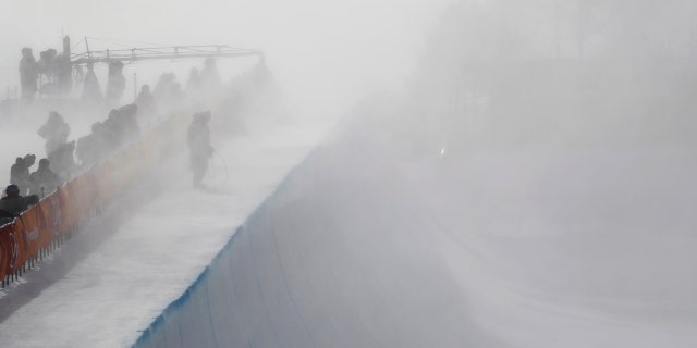 Wind gust engulfs the half pipe course during the women's halfpipe qualifying at Phoenix Snow Park in Pyeongchang, South Korea.