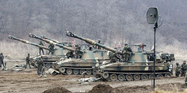 FILE: March 7, 2013: South Korean soldiers work on their K-9 self-propelled artillery vehicles during an exercise against possible attacks by North Korea near the border village of Panmunjom in Paju, South Korea.