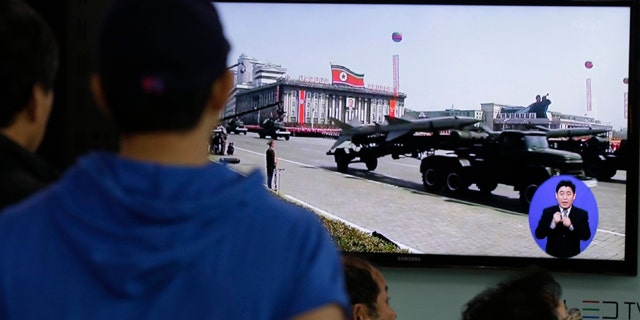 May 18, 2013: South Koreans watch TV news showing a footage of North Korean missiles on a military parade, at a Seoul Train Station in Seoul, South Korea.