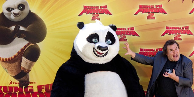 June 10, 2011: Actor Jack Black poses with a costumed 'Kung Fu Panda' at a promotional event in Madrid.