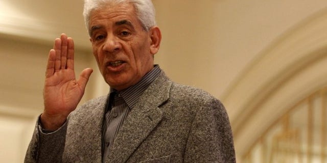 March 7: Libya's Foreign Minister Musa Kusa speaks during a news conference at a hotel housing the foreign press in Tripoli.