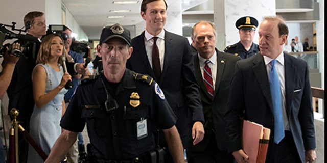White House senior adviser Jared Kushner, center, accompanied by his attorney Abbe Lowell, right, arrives on Capitol Hill in Washington., Monday, July 24, 2017, to meet behind closed doors before the Senate Intelligence Committee on the investigation into possible collusion between Russian officials and the Trump campaign. (AP Photo/J. Scott Applewhite