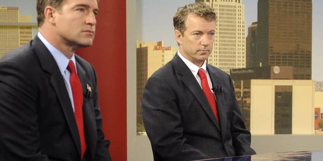 Candidates for Kentucky Senate, Democrat Jack Conway, left, and Republican Rand Paul prepare for a debate in Louisville, Ky, Sunday, Oct. 3, 2010. (AP Photo/Patti Longmire)