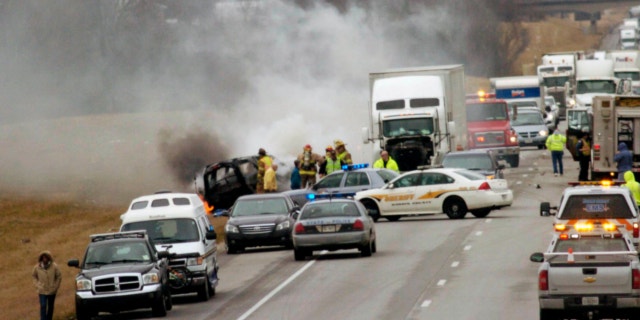 March 2, 2013: Emergency personnel work at the scene of a multi-vehicle wreck on Interstate 65 near the 82 mile marker north of Sonora, Ky.