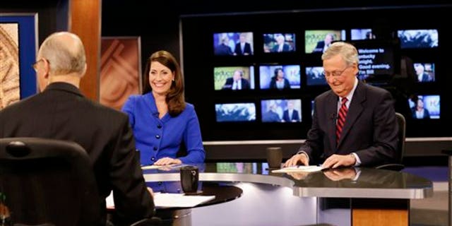 Oct. 13, 2014: U.S. Senate Republican Minority Leader Mitch McConnell Ky., right, and Democratic opponent, Kentucky Secretary of State Alison Lundergan Grimes, rehearse before their appearance on "Kentucky Tonight" in Lexington, Ky.